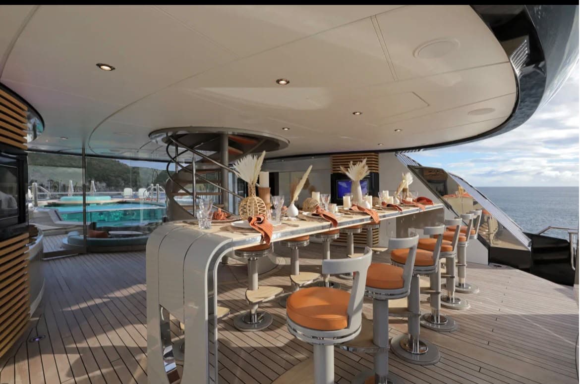 Outdoor dining setup aboard Whisper